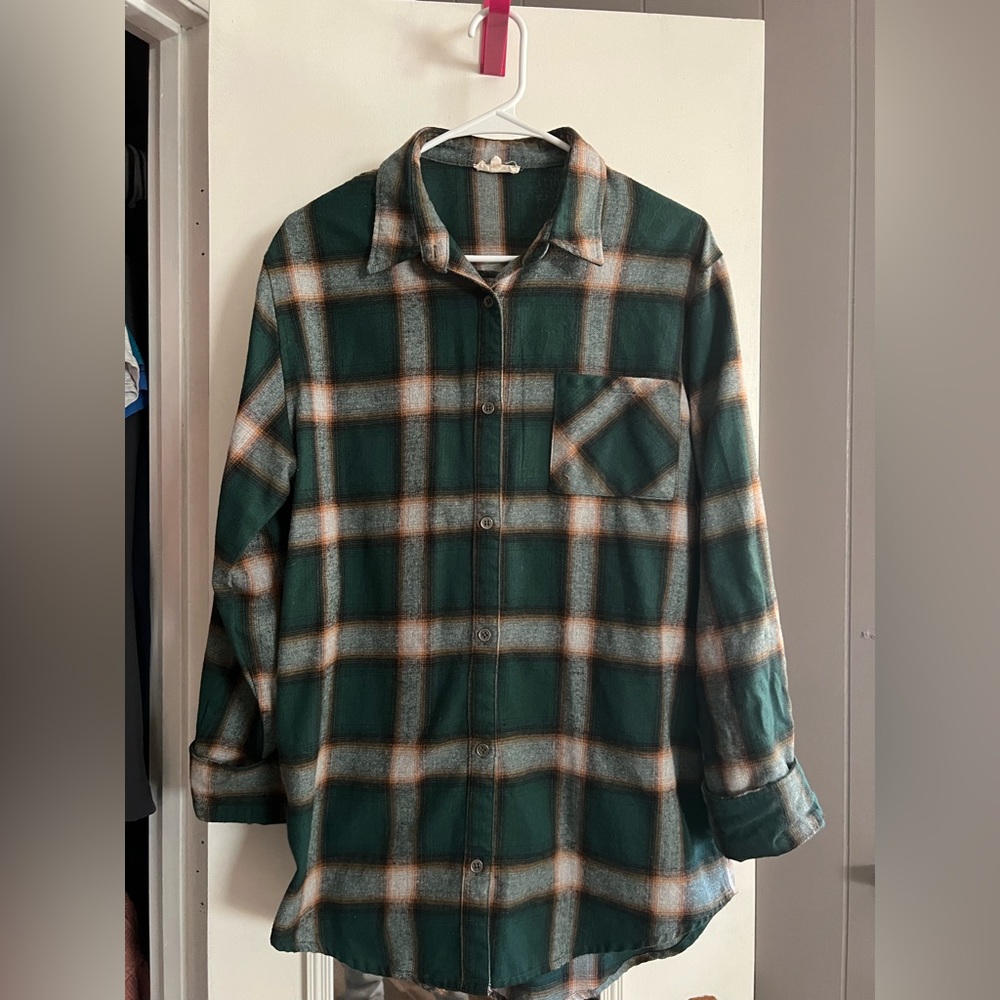 Pink Lily. Worn one time for Christmas. Oversized flannel in size small.
